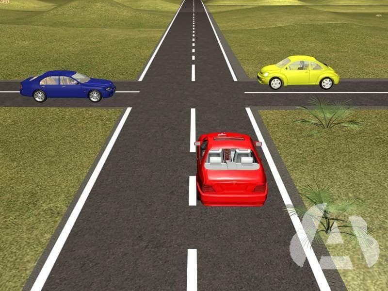 En esta intersección sin señalizar, los tres vehículos van a seguir circulando…